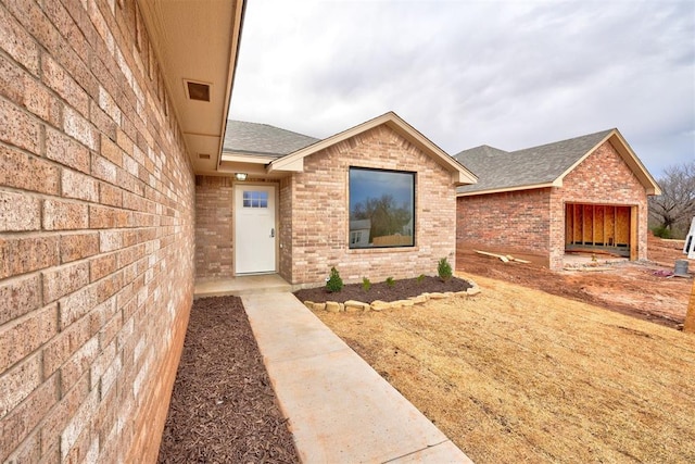 entrance to property featuring a garage