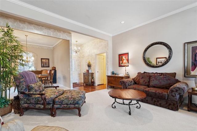 living room with hardwood / wood-style floors, an inviting chandelier, and crown molding