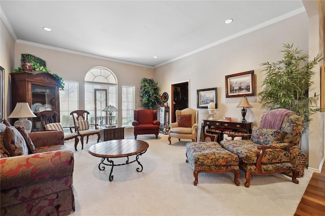 living room with hardwood / wood-style floors and ornamental molding