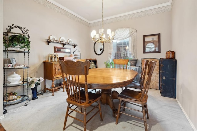 dining area featuring carpet floors, an inviting chandelier, and ornamental molding