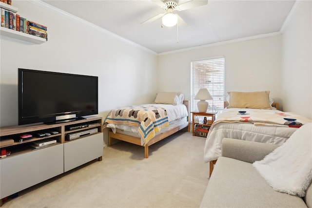 carpeted bedroom featuring ceiling fan and crown molding