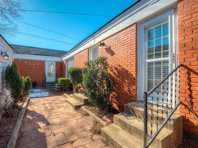 property entrance featuring a patio