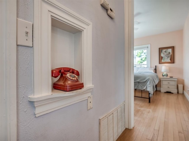 corridor featuring light hardwood / wood-style floors