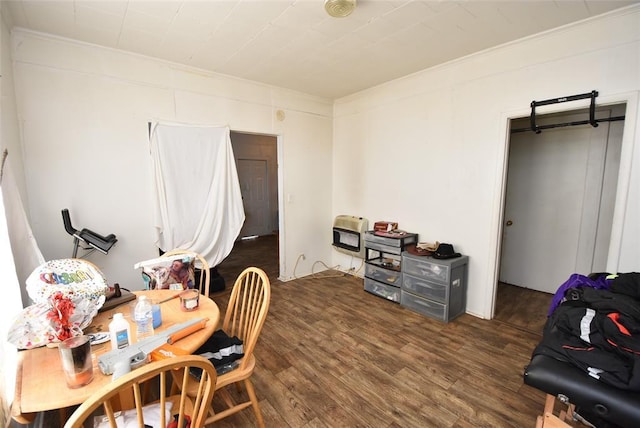 office area featuring heating unit and dark wood-type flooring