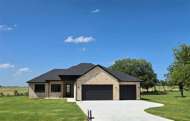 36120 Prairie Rdg, Shawnee, OK 74804 - view of front of house with an attached garage, concrete driveway, a front yard, and brick siding
