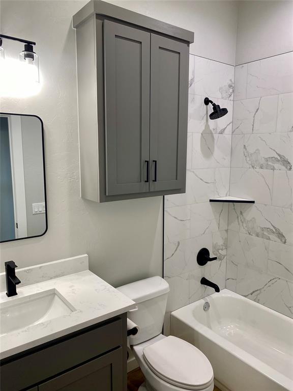 36120 Prairie Rdg, Shawnee, OK 74804 - bathroom featuring vanity and shower / washtub combination