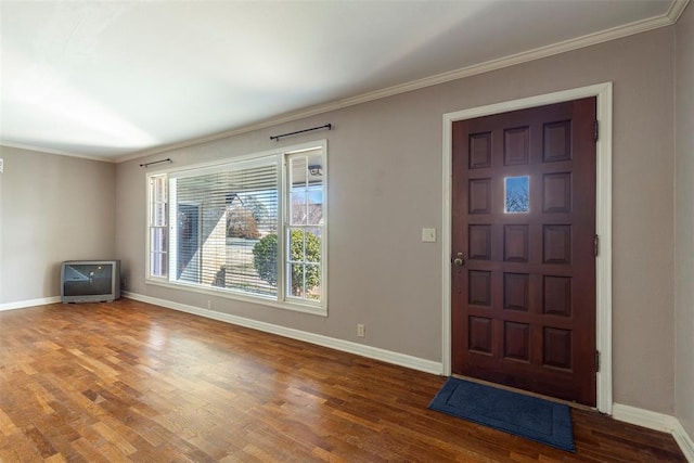 entrance foyer with hardwood / wood-style flooring and crown molding