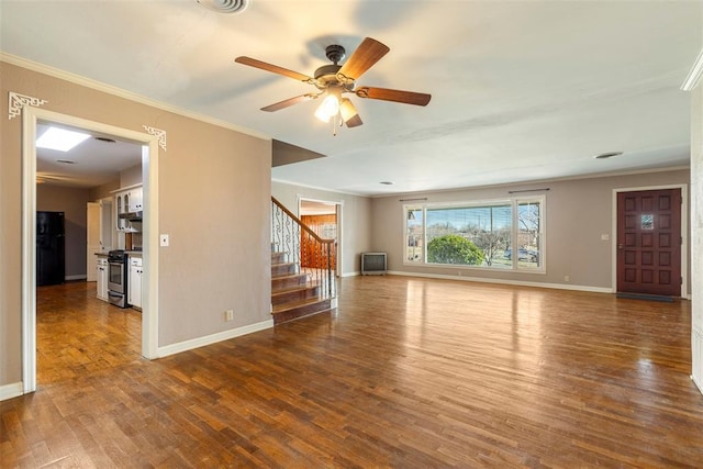 unfurnished living room featuring ceiling fan, hardwood / wood-style flooring, and crown molding