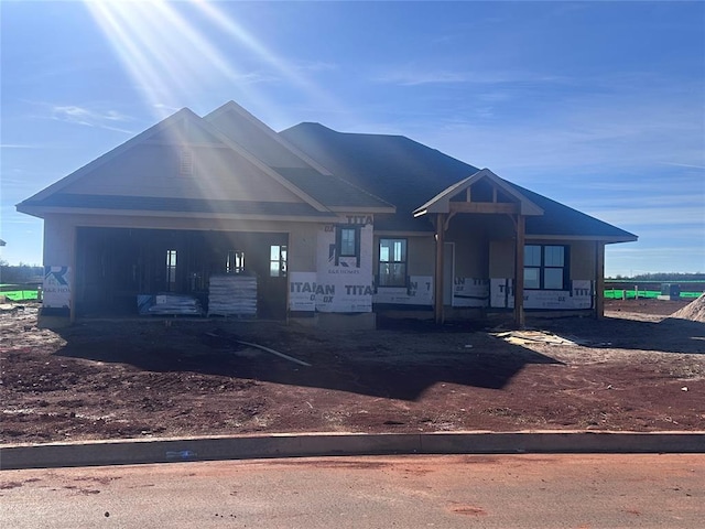 unfinished property with covered porch