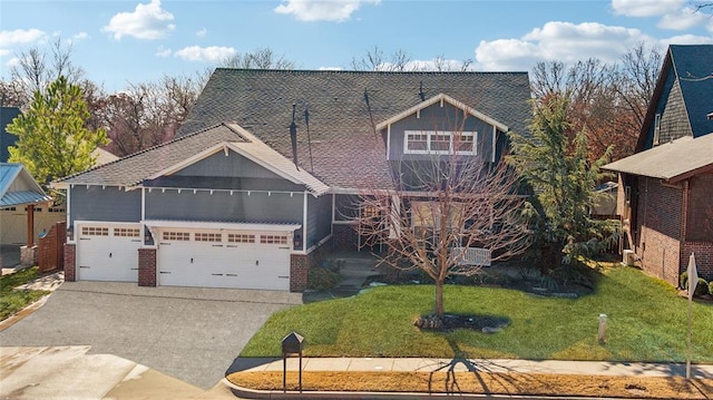 view of front of property featuring a front lawn, an attached garage, brick siding, and concrete driveway