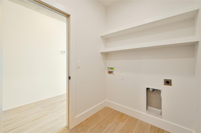 clothes washing area with hookup for a washing machine and electric dryer hookup