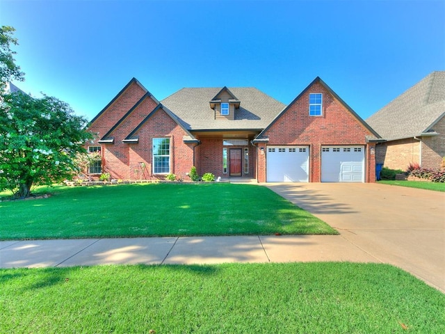 view of front of home featuring a front yard and a garage