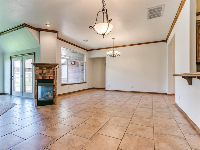 unfurnished living room featuring a brick fireplace, an inviting chandelier, light tile patterned floors, and a healthy amount of sunlight