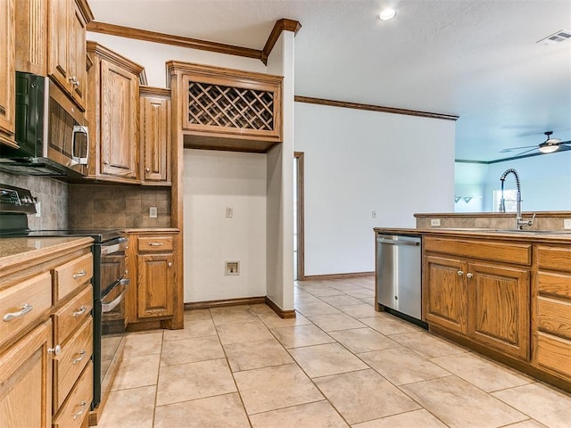 kitchen with ornamental molding, light tile patterned floors, ceiling fan, tasteful backsplash, and appliances with stainless steel finishes