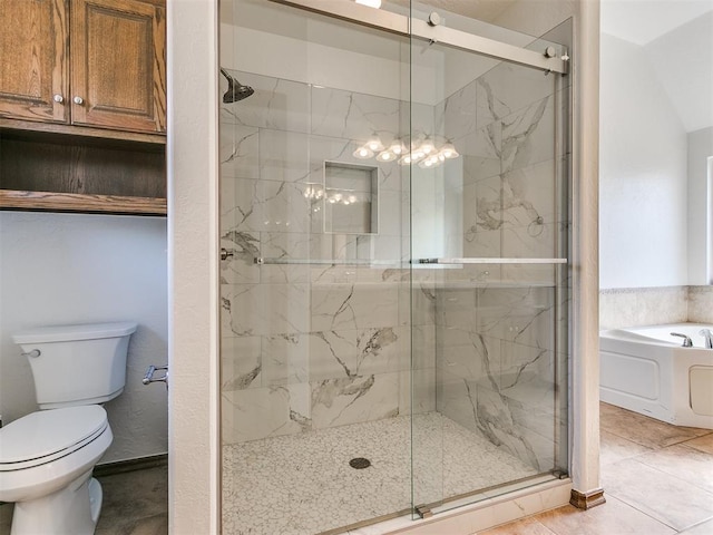 bathroom featuring toilet, tile patterned flooring, and independent shower and bath