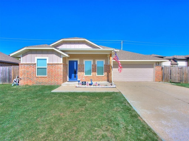 ranch-style house featuring a front yard and a garage