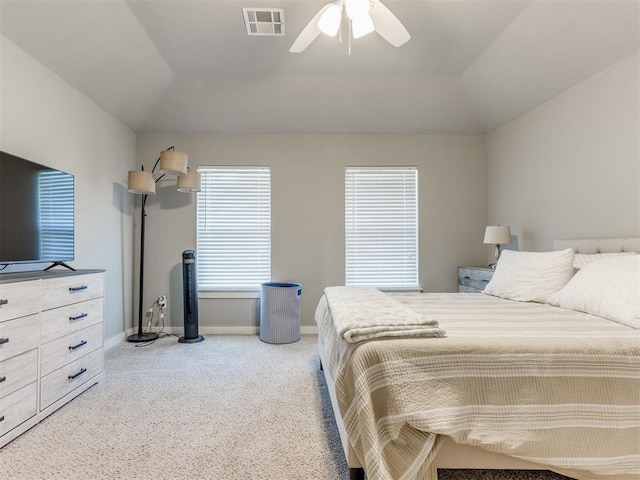 bedroom with lofted ceiling, ceiling fan, and light colored carpet