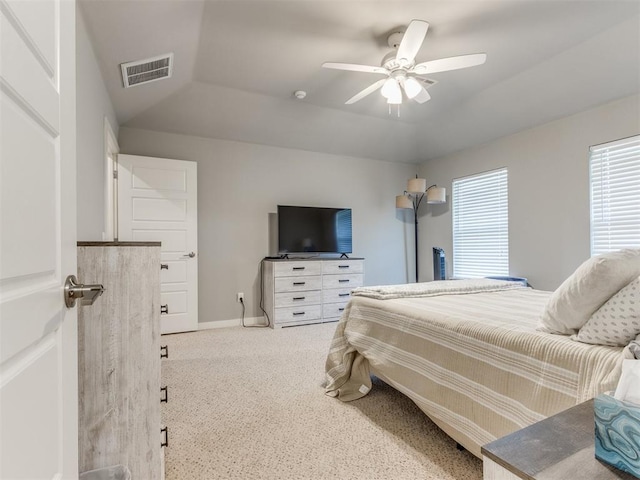 carpeted bedroom with lofted ceiling and ceiling fan