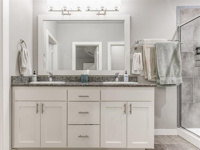 bathroom with vanity, tile patterned flooring, and a shower with shower door