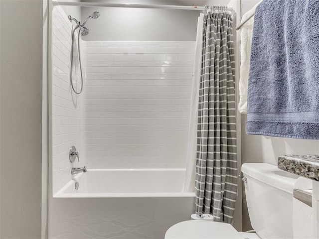 bathroom with toilet and shower / tub combo