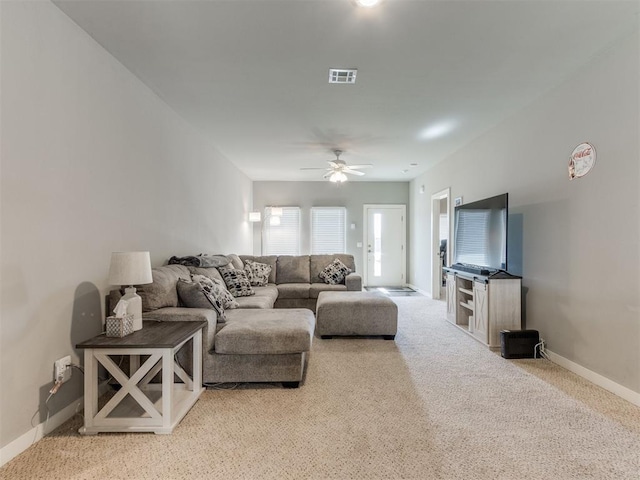 living room with carpet floors and ceiling fan