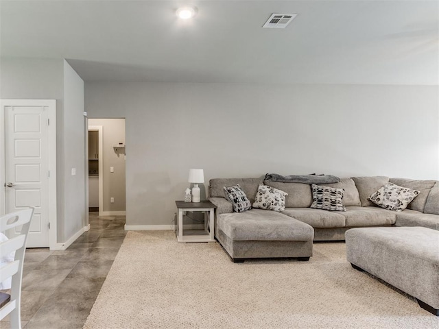 living room with concrete floors