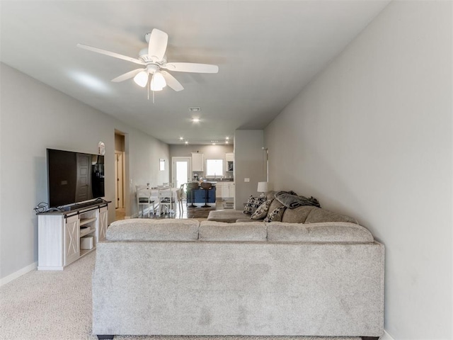 living room with ceiling fan