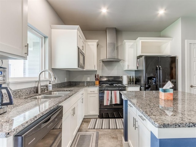 kitchen with black appliances, white cabinetry, sink, and wall chimney exhaust hood