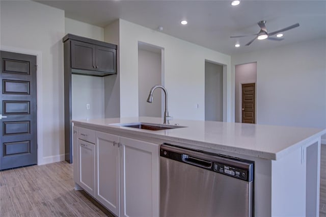 207 Hope Ave, Shawnee, OK 74804 - kitchen with stainless steel dishwasher, a ceiling fan, a kitchen island with sink, light wood-style flooring, and recessed lighting