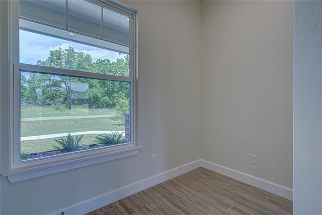 207 Hope Ave, Shawnee, OK 74804 - unfurnished room with baseboards and wood finished floors