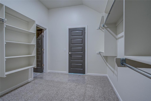 207 Hope Ave, Shawnee, OK 74804 - spacious closet with carpet flooring and vaulted ceiling