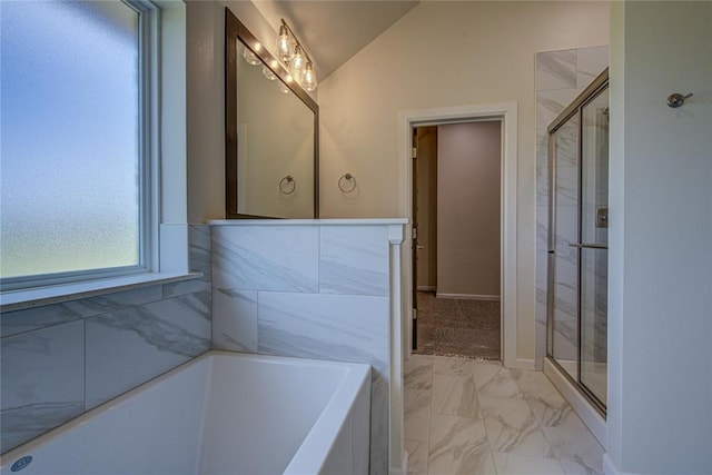 207 Hope Ave, Shawnee, OK 74804 - bathroom featuring a bathtub, marble finish flooring, a stall shower, and vaulted ceiling