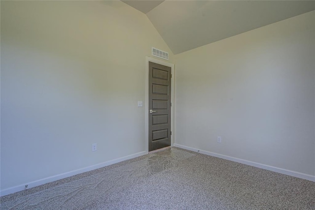 207 Hope Ave, Shawnee, OK 74804 - spare room featuring light carpet and vaulted ceiling