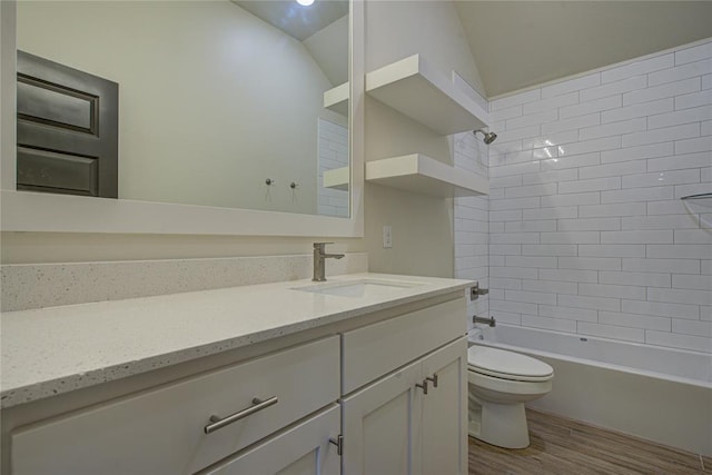 207 Hope Ave, Shawnee, OK 74804 - full bath featuring vanity, wood finished floors, vaulted ceiling, and  shower combination