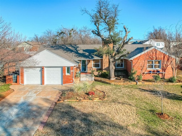 single story home with a front yard and a garage