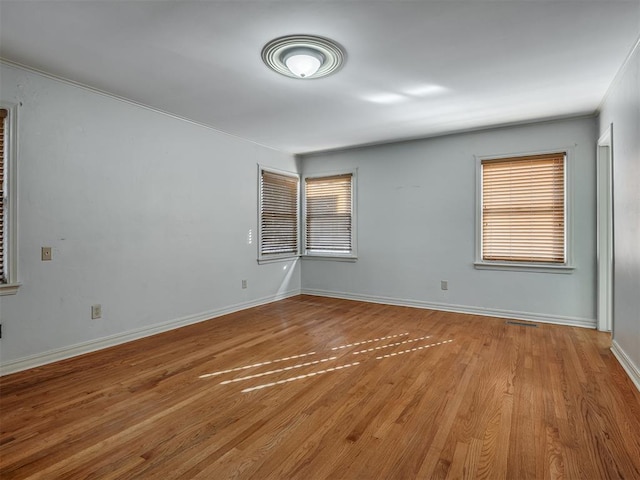 spare room featuring light hardwood / wood-style floors