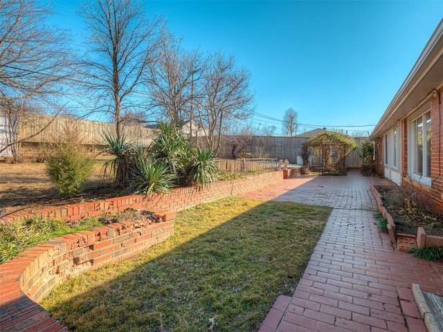 view of yard featuring a gazebo and a patio area