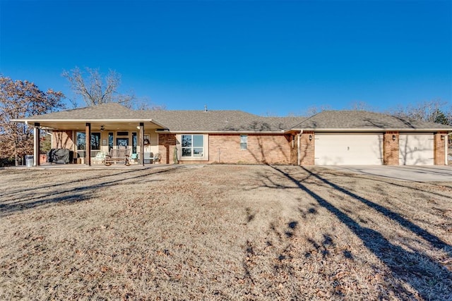 ranch-style house with a garage and a porch