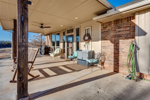 view of patio / terrace featuring ceiling fan