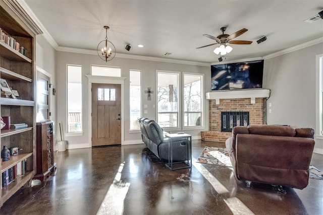 living room with ceiling fan with notable chandelier, a fireplace, and crown molding