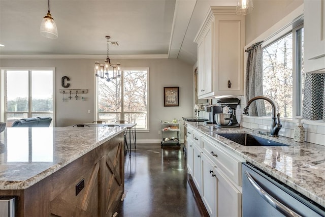 kitchen with sink, white cabinetry, dishwasher, and pendant lighting