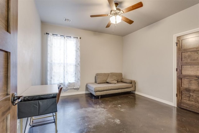 living area featuring ceiling fan