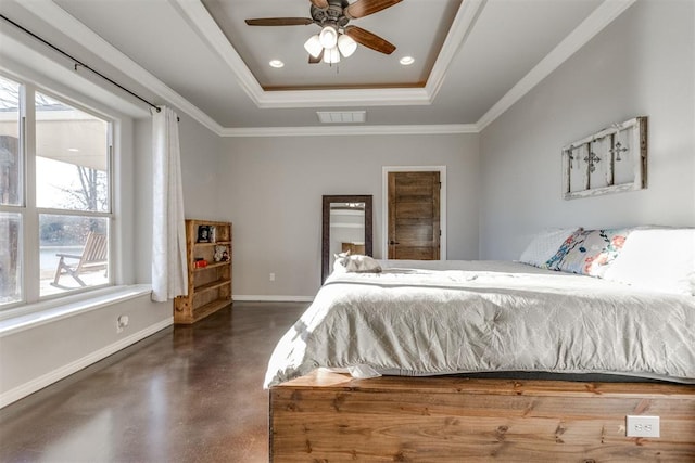 bedroom featuring ceiling fan, ornamental molding, and a tray ceiling