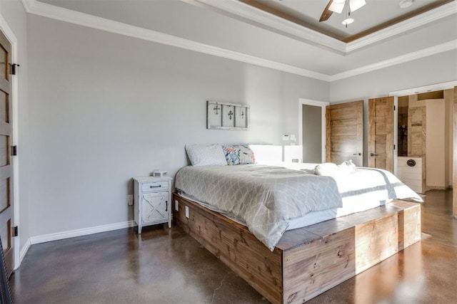 bedroom with ceiling fan, a tray ceiling, and ornamental molding