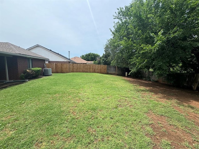 view of yard with central AC