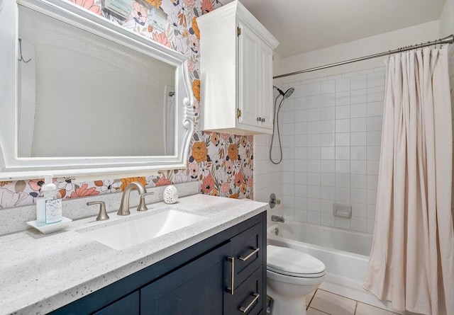 full bathroom featuring toilet, shower / bath combo with shower curtain, tile patterned floors, and vanity