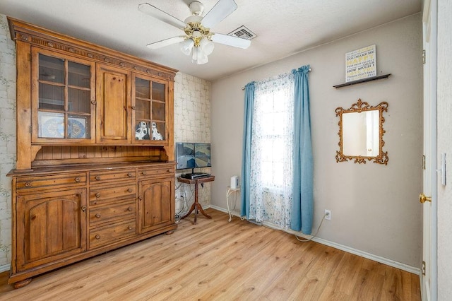 interior space with ceiling fan and light wood-type flooring