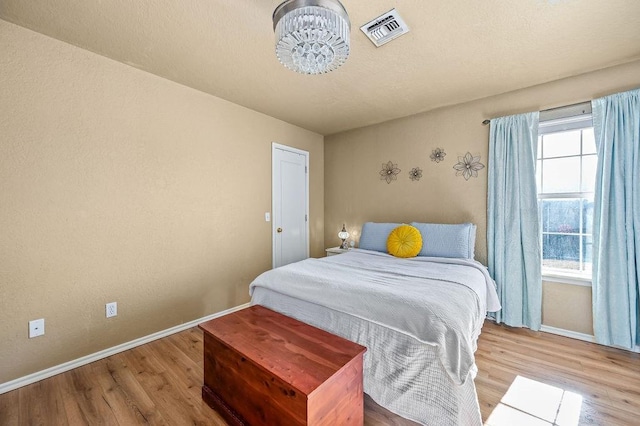 bedroom featuring wood-type flooring