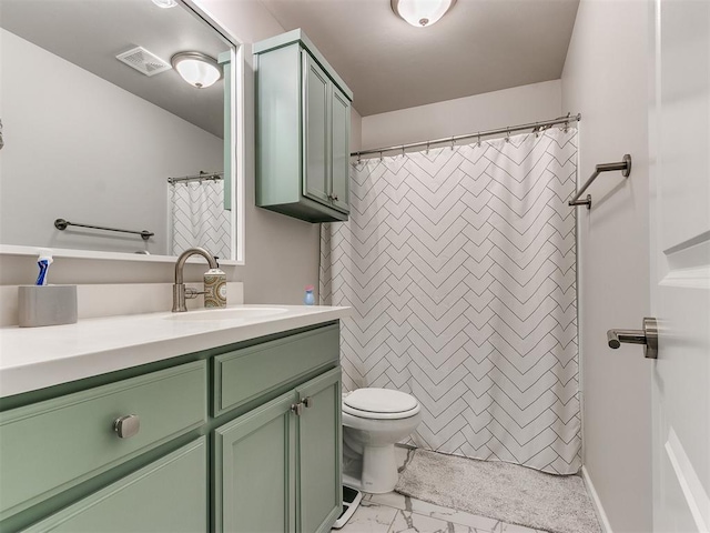 bathroom featuring toilet, vanity, and a shower with curtain