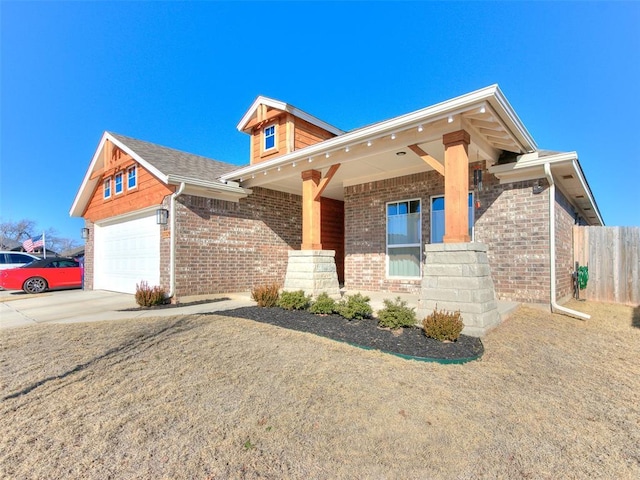 view of front of home featuring a porch and a garage